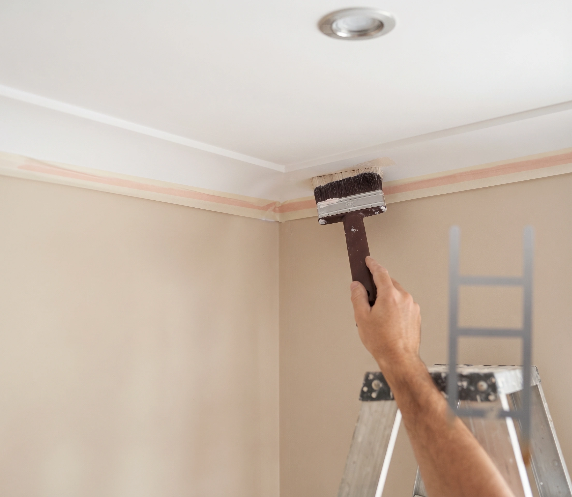 Ceiling, cornice and trims being cut in by hand with edges masked