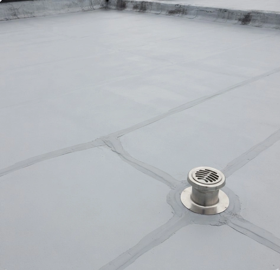The same roof graded to the outlet and coated, with the ponding gone